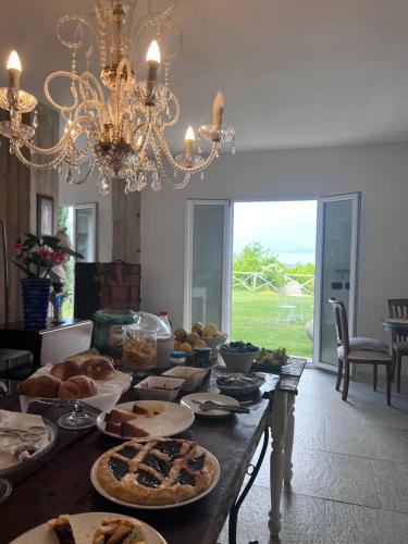 a table topped with lots of different types of food at Villa Giovanna in Sorrento