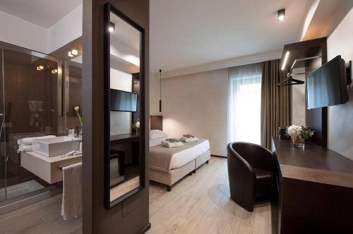 a hotel room with a bed and a bathroom at Sport Village Hotel & Spa in Castel di Sangro