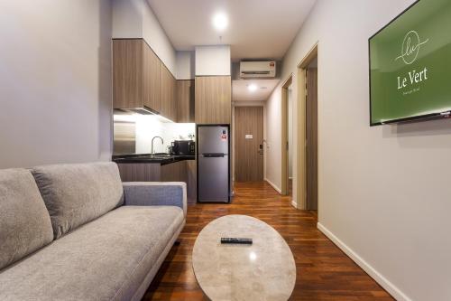 a living room with a couch and a table at Le Vert Boutique Hotel in Genting Highlands