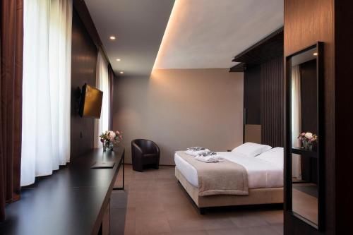a hotel room with a bed and a television at Sport Village Hotel & Spa in Castel di Sangro
