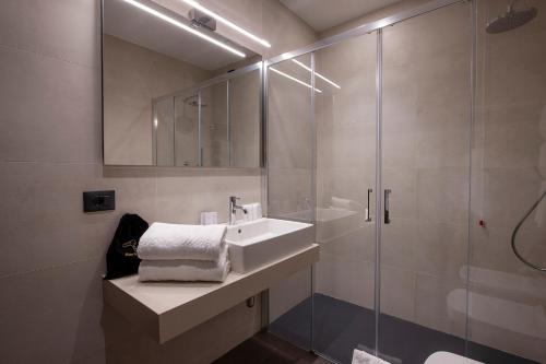 a bathroom with a sink and a shower at Sport Village Hotel & Spa in Castel di Sangro