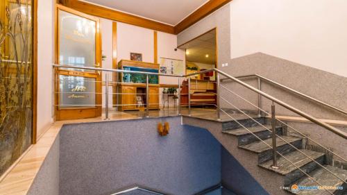 a staircase in a building with a lobby at Anomis in Cîmpulung