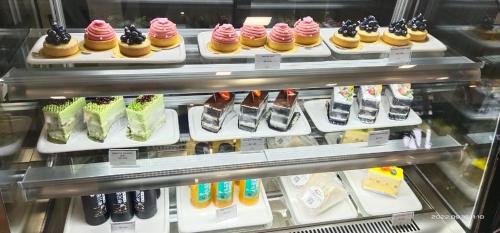 a display case filled with lots of different types of shoes at CHRISTEE SUITES HOTEL in Melaka