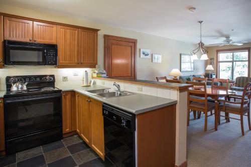 a kitchen with a sink and a stove top oven at 2211 - Two Bedroom Standard Eagle Springs East condo in Solitude