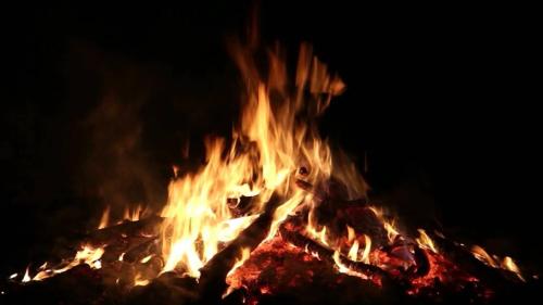 a fire is burning in the dark at Coorg Bliss Estate Stay in Madikeri