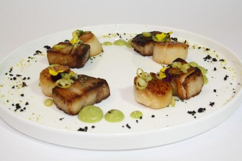 a plate of food on a white plate at Hotel El Juglar in Olite