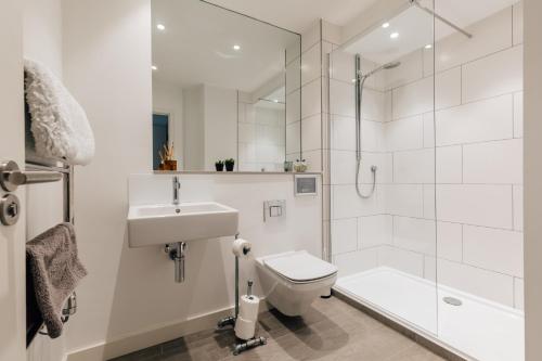 a bathroom with a toilet and a sink and a shower at Charlecote House in Bath