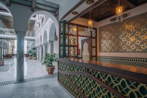 a lobby of a building with colorful tiles at Apartamentos Turísticos La Baílla in Rota