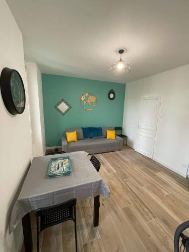 a living room with a couch and a table at L'encre - T2 4 Personnes - Port 2' Plage10' in La Seyne-sur-Mer