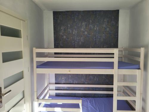 Postel nebo postele na pokoji v ubytování Domek Lipek