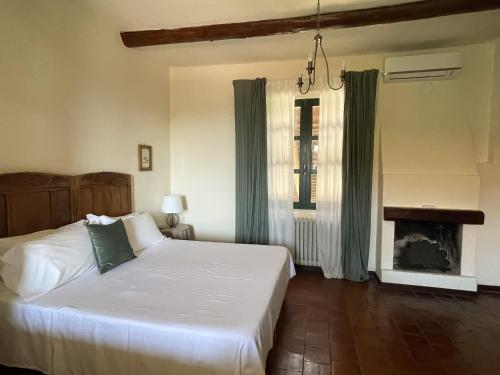 Ένα ή περισσότερα κρεβάτια σε δωμάτιο στο Agriturismo La Margherita