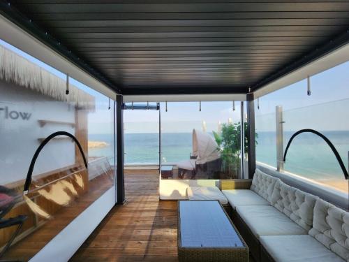 a living room with a view of the ocean at Mr. Slow in Sokcho