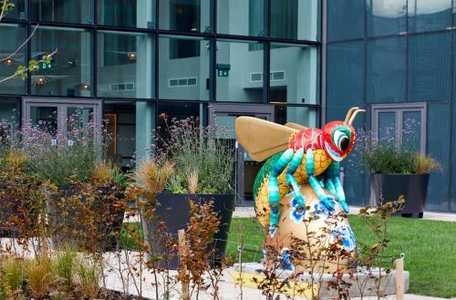 a statue of a lobster in front of a building at Hyatt House Manchester - Aparthotel in Manchester