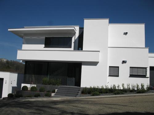 a white house with a lot of windows at Traumblick Vallendar 2.0 in Vallendar