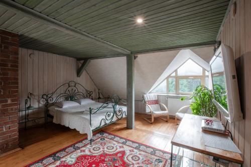 a bedroom with a bed in a attic at Маєток Ліс і Гори in Bukovel