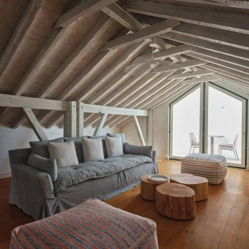 a living room with a couch and tables in a building at Look Living, Lisbon Design Apartments in Lisbon