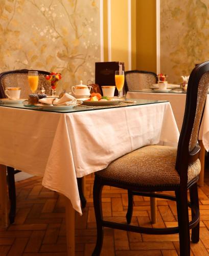 a table with a plate of food and drinks on it at Kilronan House in Dublin