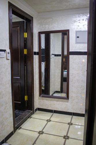 a room with two mirrors on the wall at The Castle Hotel in Amman