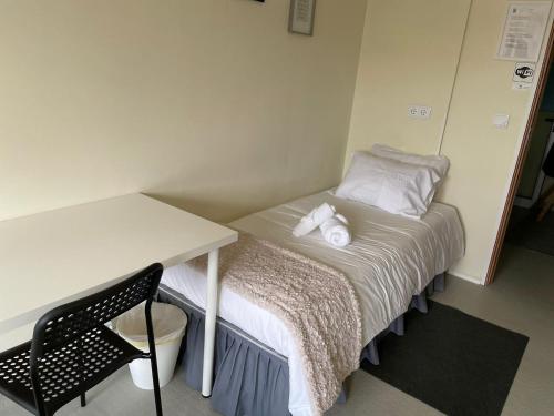 Ένα ή περισσότερα κρεβάτια σε δωμάτιο στο Liber Guest House