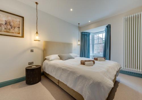Postel nebo postele na pokoji v ubytování Vine Cottage