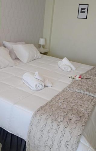 Ένα ή περισσότερα κρεβάτια σε δωμάτιο στο Liber Guest House