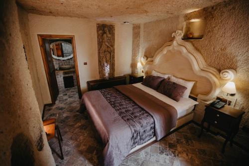 Postel nebo postele na pokoji v ubytování Artium Cave Hotel