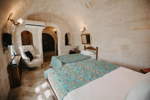 Postel nebo postele na pokoji v ubytování Artium Cave Hotel