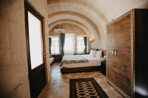 Postel nebo postele na pokoji v ubytování Artium Cave Hotel