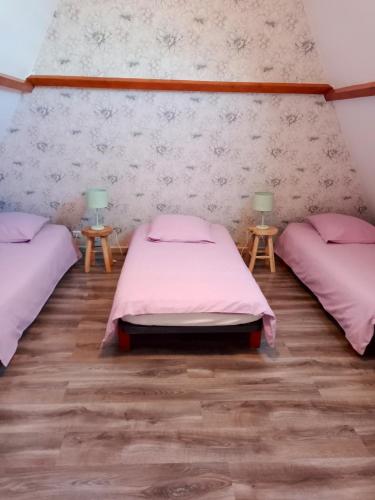 a room with two beds and two lamps on tables at Maison de 2 chambres avec jardin clos et wifi a Epreville en Lieuvin in Épreville-en-Lieuvin