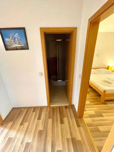 a room with a door leading to a bedroom at Apartments Anita and Zoran in Stanići