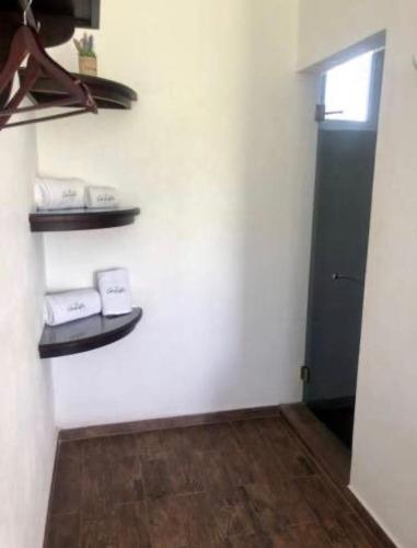 a room with a door and shelves on the wall at Ananta Hotel in Las Casitas