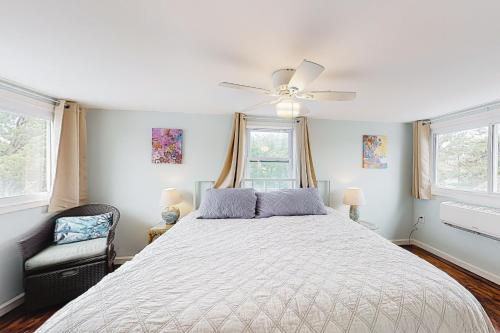 a bedroom with a bed and a ceiling fan at Town of Rehoboth 20 Delaware Ave in Rehoboth Beach