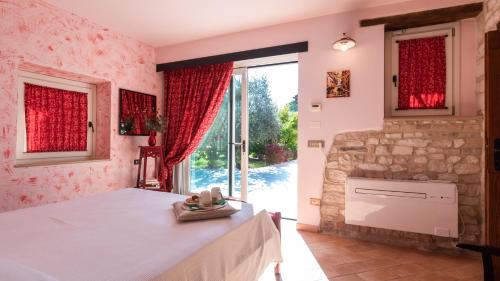 Katil atau katil-katil dalam bilik di CASCINA MARIANNA 12&4, Emma Villas