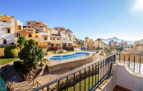 een uitzicht vanaf het balkon van een villa met een zwembad bij Stunning Home In Cartagena With Kitchen in Cartagena