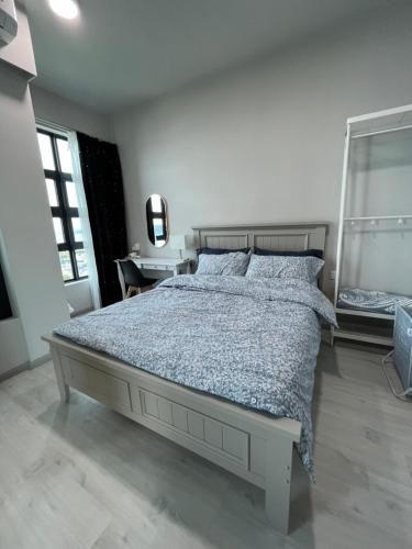 a white bedroom with a bed and a desk at Mango House3-LuxurySweet I Biggest unit I infinity pool I Wifi-JQ in Kota Kinabalu