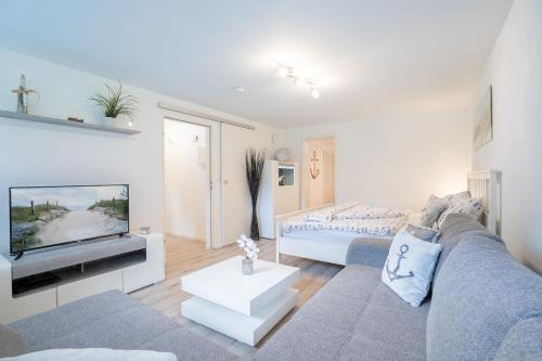 En eller flere senge i et værelse på MiBa Mare Ferienwohnung "Luna"