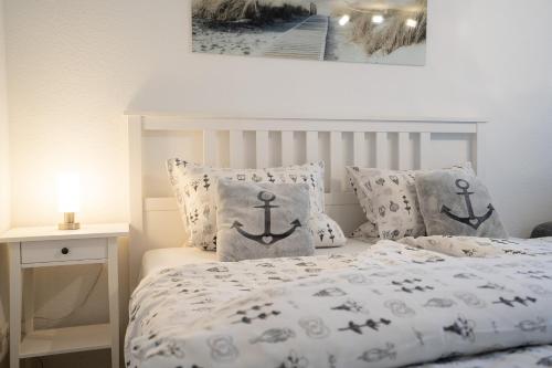 En eller flere senge i et værelse på MiBa Mare Ferienwohnung "Luna"