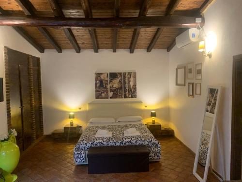 Un pat sau paturi într-o cameră la B&B Villa Loriana