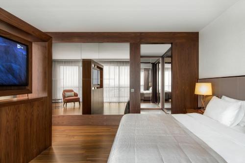 a hotel room with a bed and a television at Lionel Hotel Istanbul in Istanbul