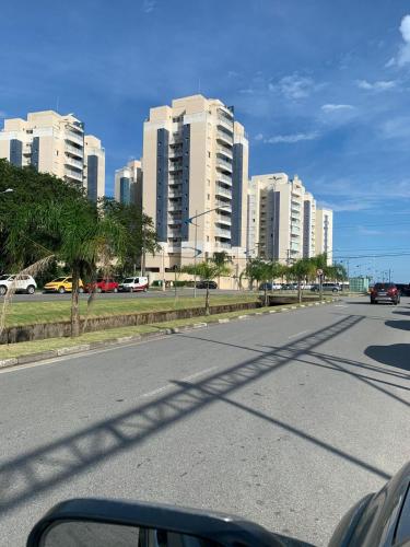 a view of a city street with tall buildings at RESERVA DO MAR in Bertioga
