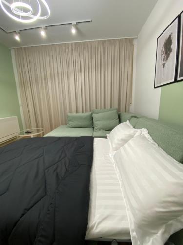 Katil atau katil-katil dalam bilik di Tirana Primo Apartment