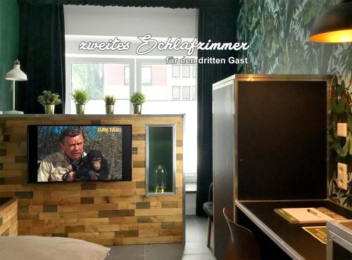 Wohnungen mit Balkon, ruhig & zentral, nahe Centro & Arenaにあるテレビまたはエンターテインメントセンター