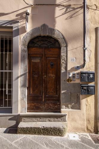 a wooden door on the side of a building at IBibiena - CASA DI DIEGO in Bibbiena