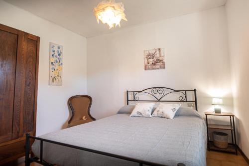 a bedroom with a bed with two pillows on it at Casa di Monica in Torre San Severo
