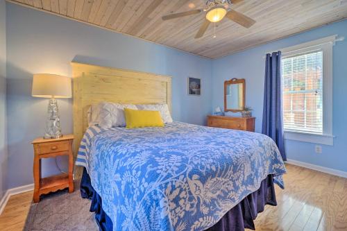 a bedroom with a bed and a ceiling fan at Peaceful Wilmington Home Near Beach and Downtown! in Carolina Beach