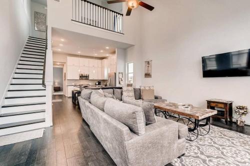 a living room with a couch and a table at Fam Friendly 5 Bed Home Blocks To Pearl/Riverwalk! in San Antonio