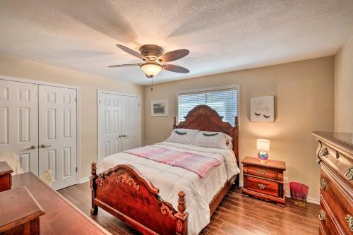 a bedroom with a bed and a ceiling fan at Pet-Friendly Home about 6 Mi to Downtown Fort Worth! in Fort Worth