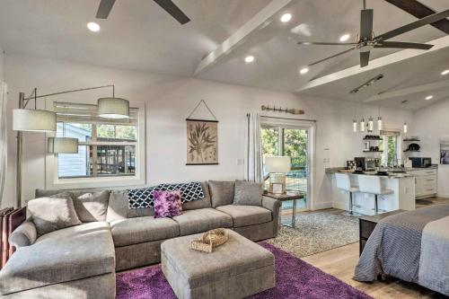 a living room with a couch and a kitchen at Lovely Toledo Bend Studio with Scenic Views! in Many