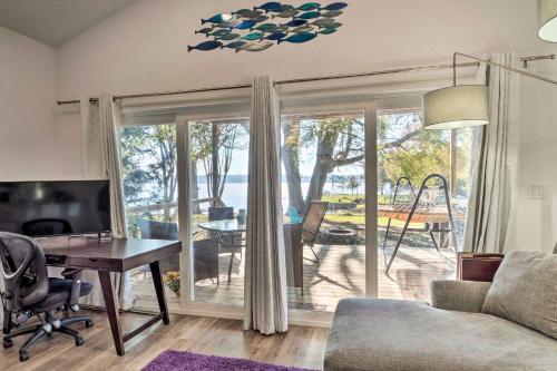 a living room with a couch and a desk and a table at Lovely Toledo Bend Studio with Scenic Views! in Many