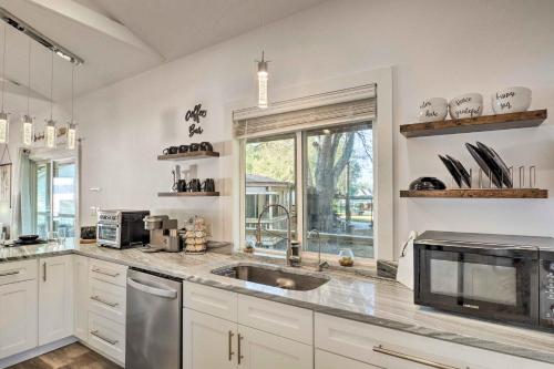 a kitchen with a sink and a window at Lovely Toledo Bend Studio with Scenic Views! in Many